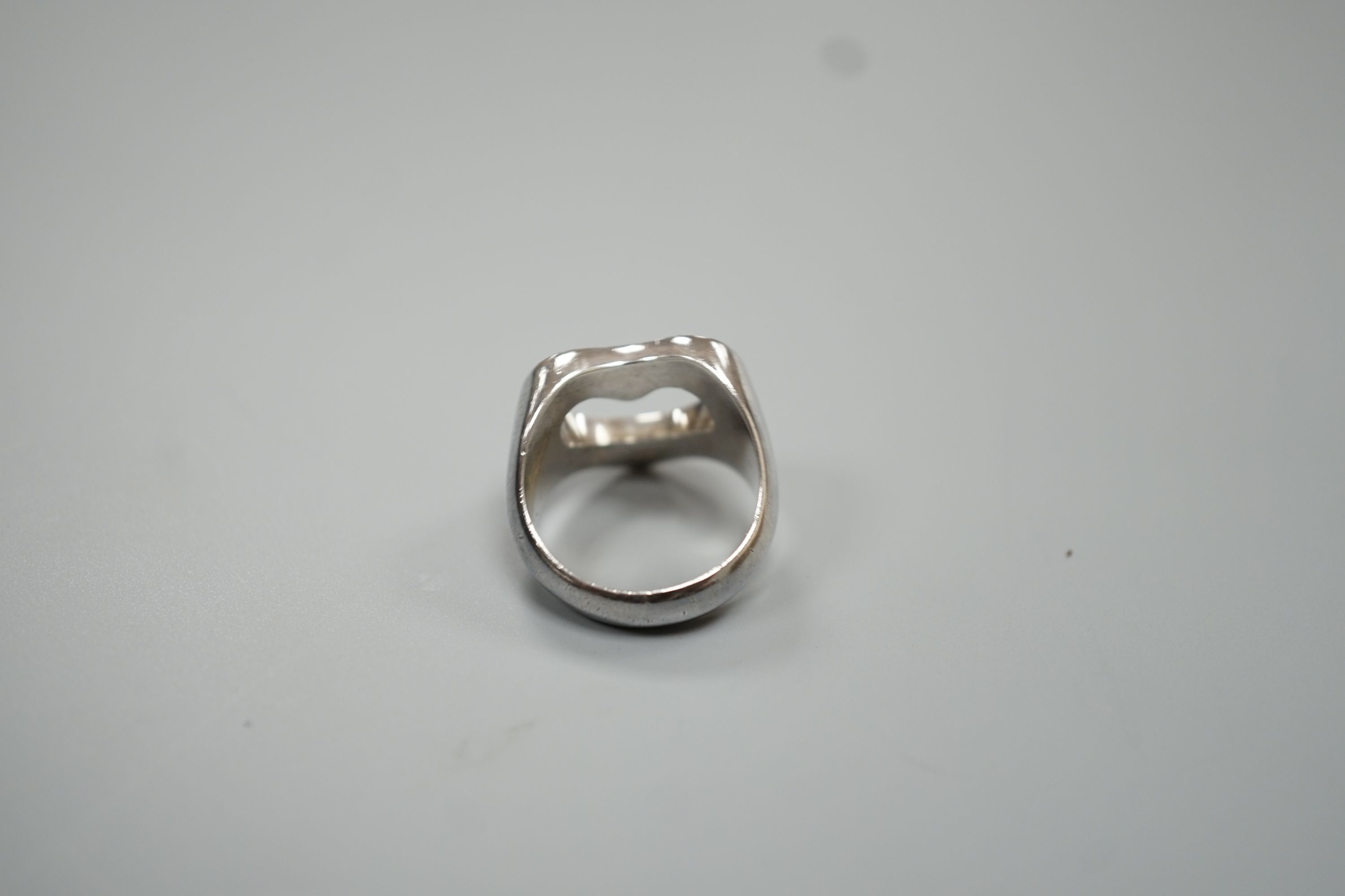 A Georg Jensen sterling pierced heart shaped ring, size M/N, 9.9 grams.